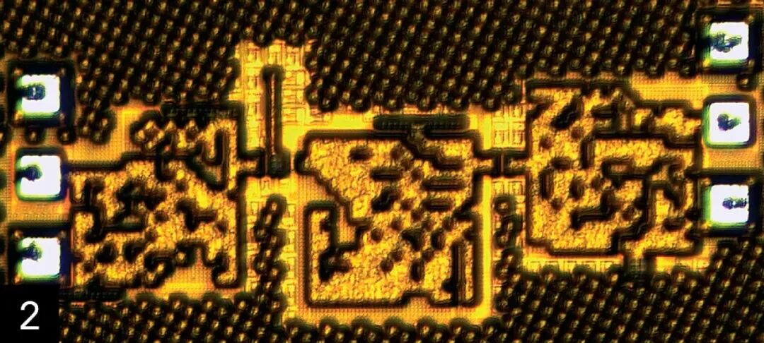 Close-up of a glowing gold microchip circuit with dense patterned components.